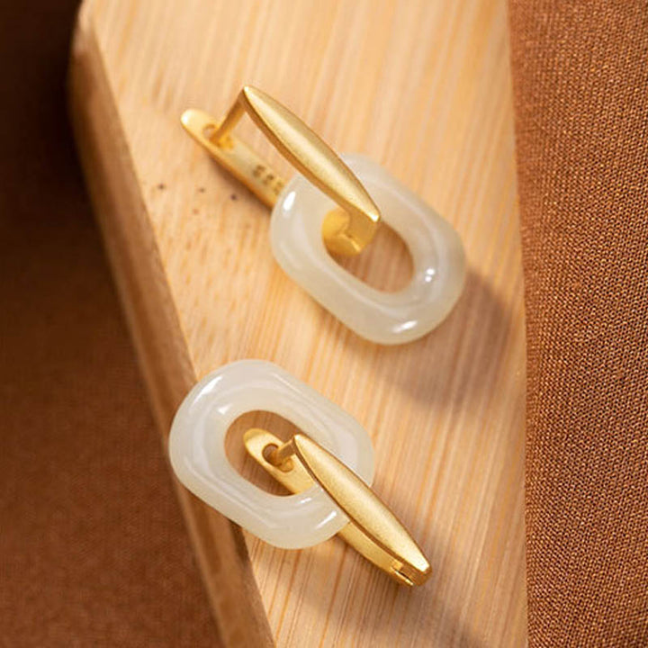 Orecchini Buddha Stones in argento sterling 925 con giada bianca rotonda e benedizione della felicità