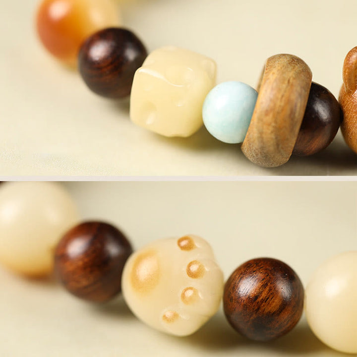 Buddha Stones Semi di Bodhi naturali Sandalo Fortunato Gatto Carino Testa Zampa Artiglio Braccialetto della Pace - image 5