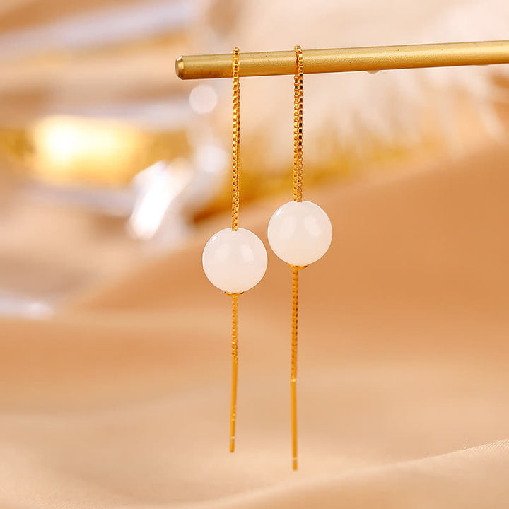 Orecchini pendenti in argento sterling 925 con perline di giada bianca e simbolo della felicità