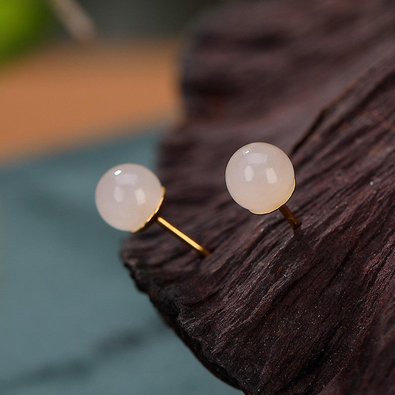 Orecchini a bottone rotondi in giada bianca con Buddha Stones in argento sterling 925