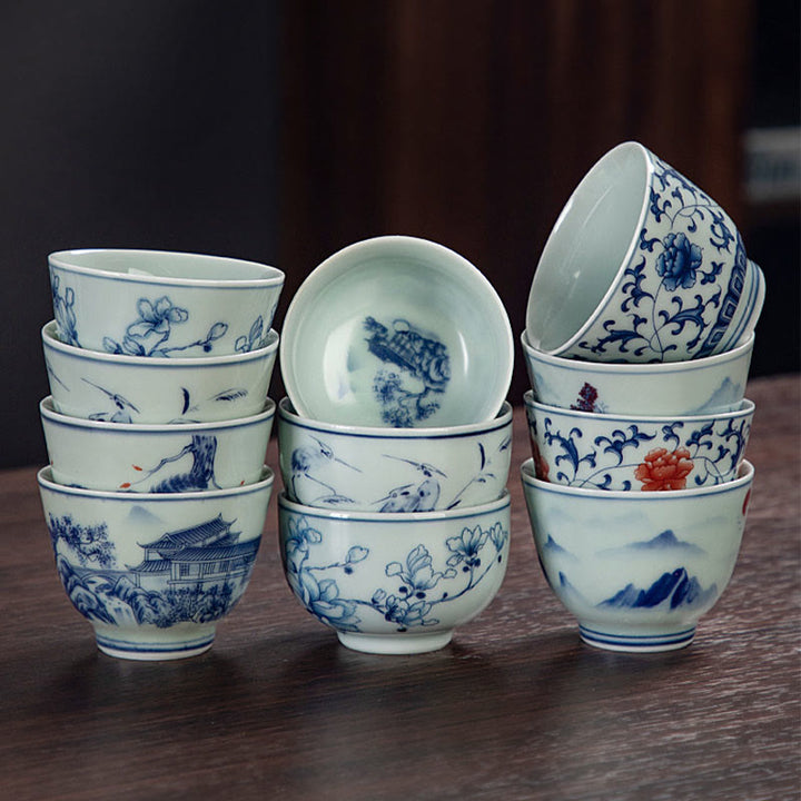 Buddha Stones Paesaggio blu Montagne Loto Gatto carino Padiglioni Magnolia Canna Aironi Tazza da tè in ceramica Piccola tazza da tè Kung Fu