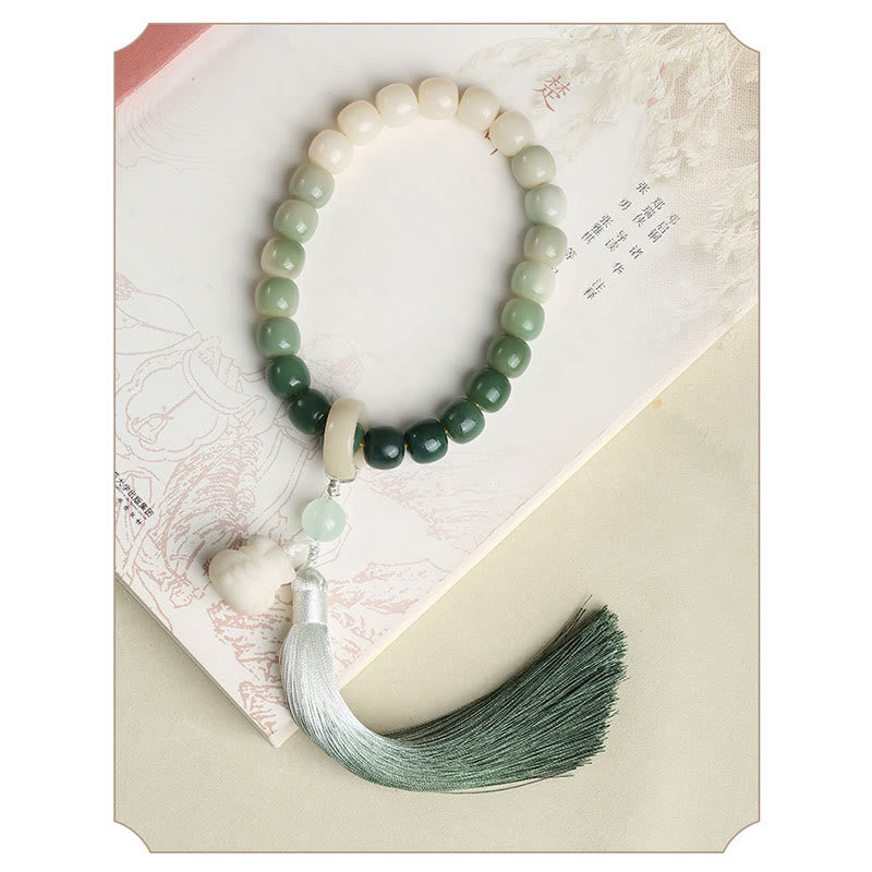 Buddha Stones Naturale Gradiente Bodhi Seed Fortuna Sacchetto di Denaro Loto Saggezza Nappa Polso Mala