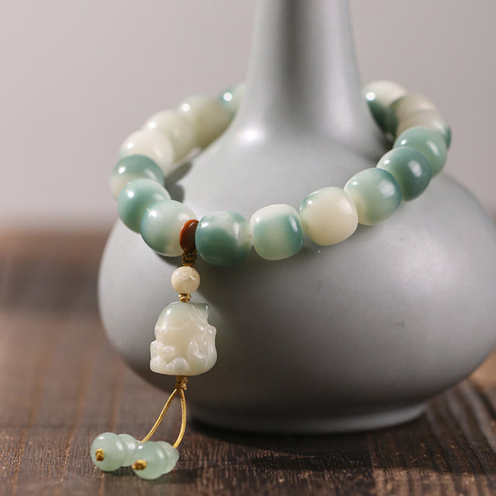 Bracciale della pace Buddha Stones, semi di Bodhi sfumati, volpe a nove code, zampa di gatto, artiglio di pigna - image 2