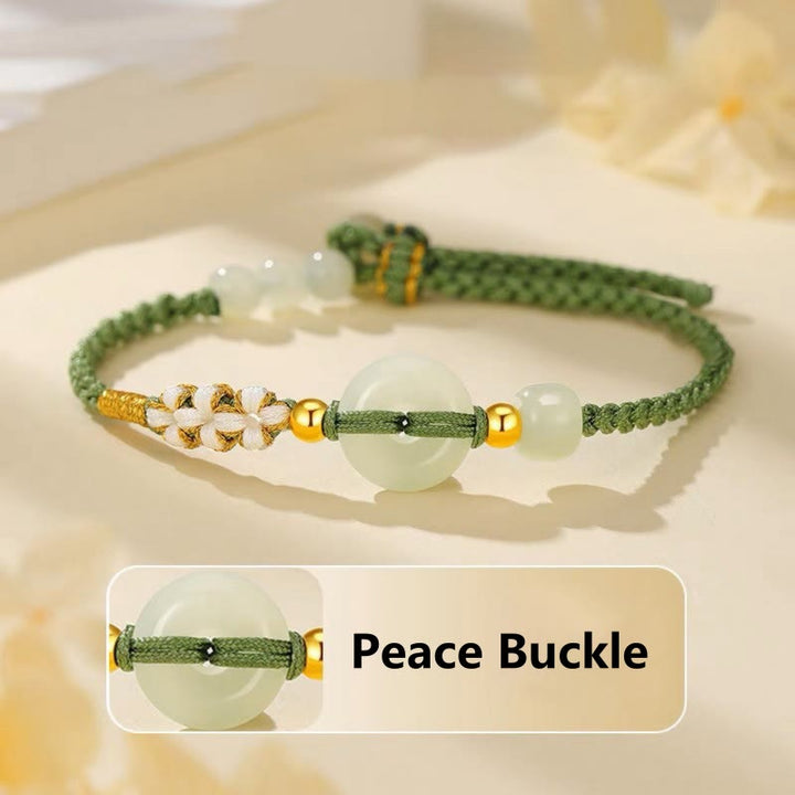 Bracciale intrecciato con Buddha Stones, giada Hetian, fibbia della pace, fortuna e fiori di pesco