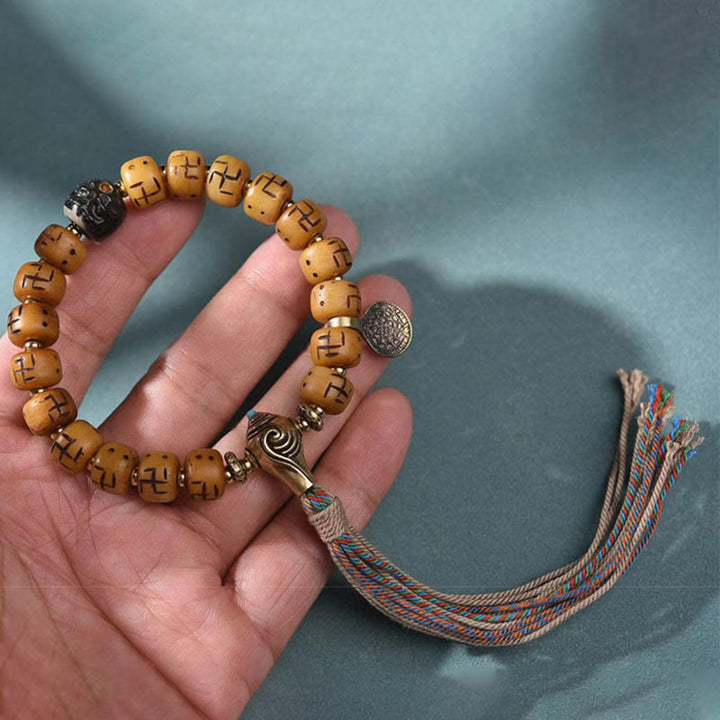 Buddha Stones naturale tibetano osso di cammello svastica Dzi perlina Shankha Buddha fascino Kirtimukha braccialetto con nappa protezione fortuna