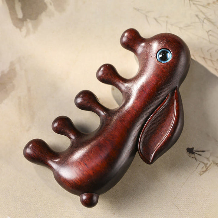 Pettine per massaggio rilassante con coniglietto di sandalo rosso a foglia piccola e sandalo verde