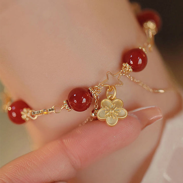 Bracciale Buddha Stones placcato oro 14k con ciondolo a forma di fiore di agata rossa e stella