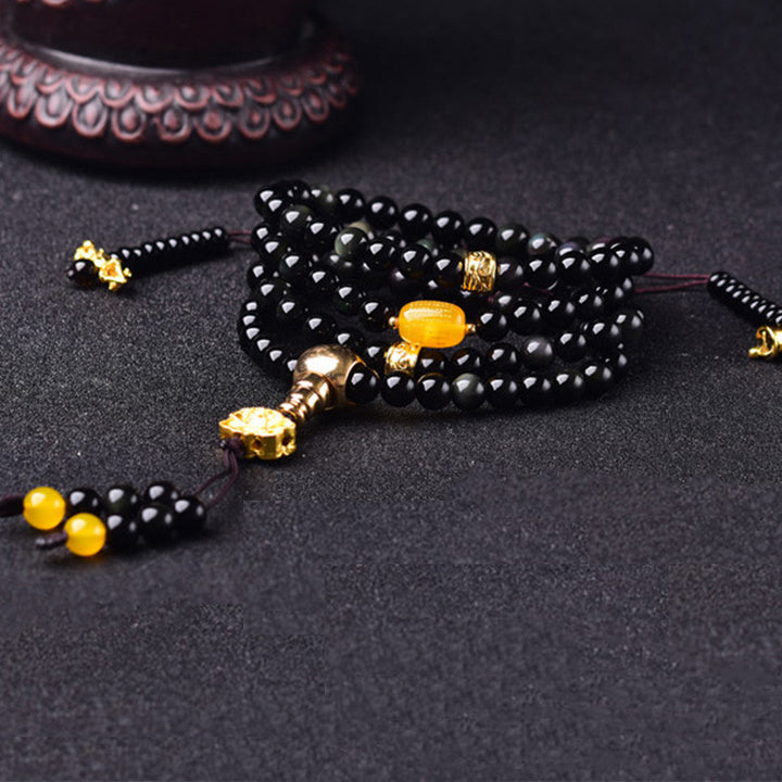 Braccialetto Mala Buddha Stones 108 perle in ossidiana nera naturale Lotus Fulfilment