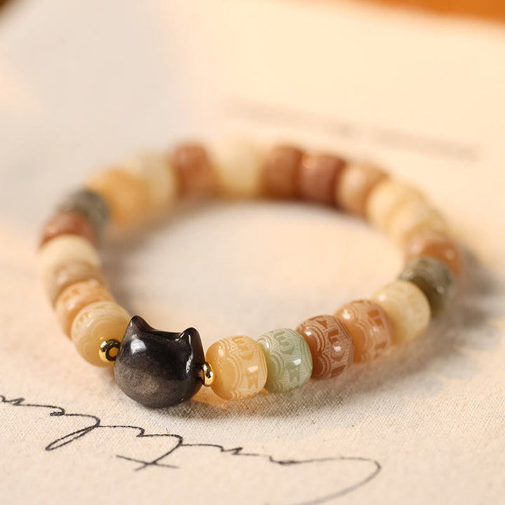 Buddha Stones Semi di Bodhi Argento Lucentezza Ossidiana Testa di Gatto Om Mani Padme Hum Braccialetto Armonia Inciso - Seme di Bodhi giallo (circonferenza del polso 14-16 cm) - image 1