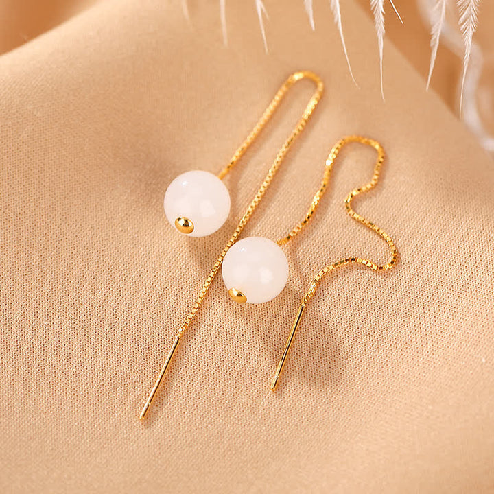 Orecchini pendenti in argento sterling 925 con perline di giada bianca e simbolo della felicità