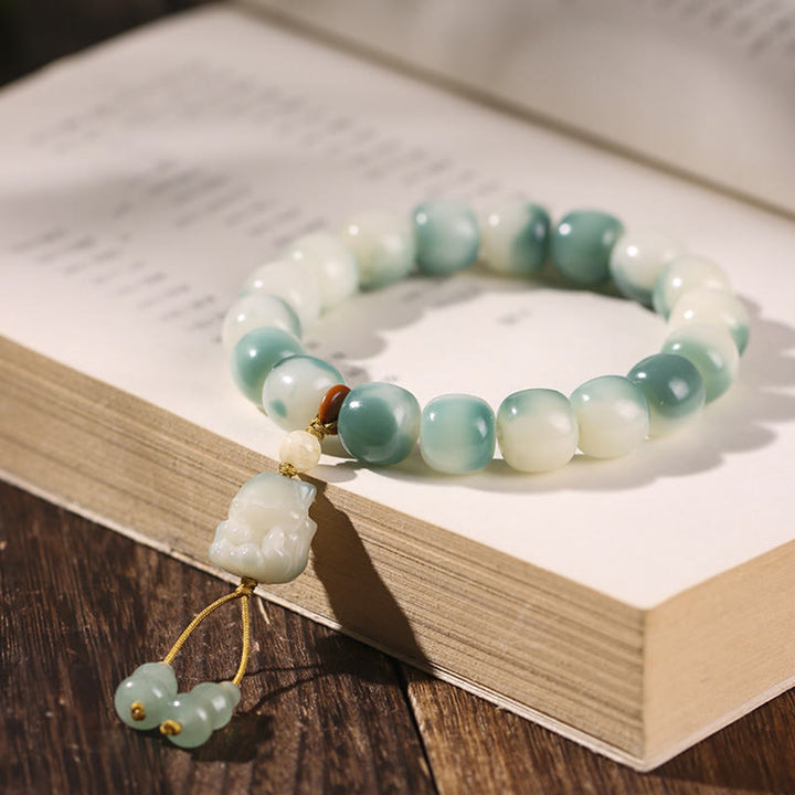 Bracciale della pace Buddha Stones, semi di Bodhi sfumati, volpe a nove code, zampa di gatto, artiglio di pigna - Volpe a nove code (Volpe a nove code colore casuale - circonferenza del polso 16-17 cm) - image 1