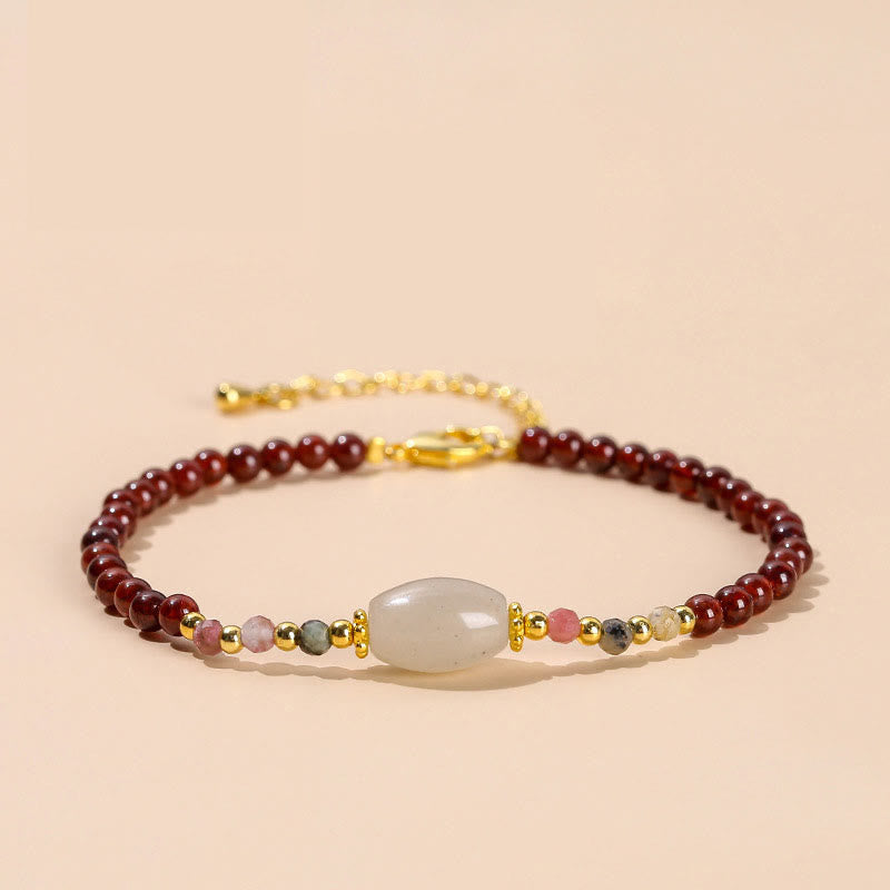Bracciale Buddha Stones con perline di giada, tormalina e granato