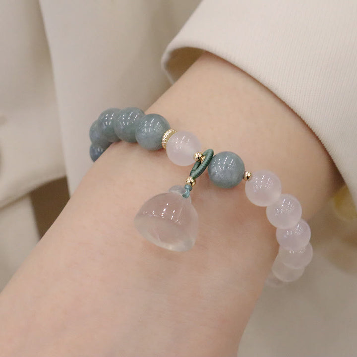 Braccialetto di protezione con fibbia della pace, fiore di loto, agata bianca e giada Buddha Stones