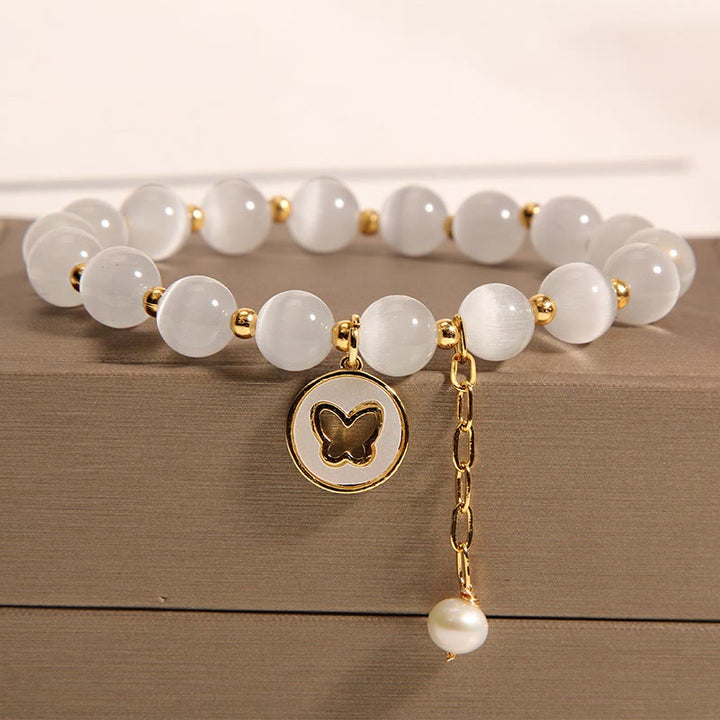 Braccialetto dell'amore con ciondolo a farfalla con occhio di gatto Buddha Stones