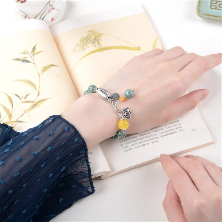 Bracciale Buddha Stones in argento sterling 925, giada ciano, ambra e successo
