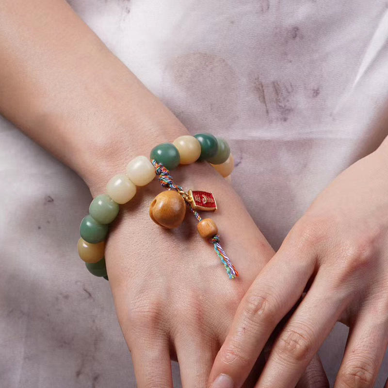 Braccialetto con ciondolo a tamburo di pesce in legno con semi di Bodhi e Buddha Stones, sfumatura naturale