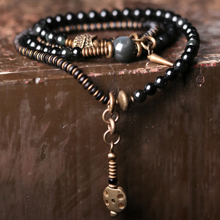 Braccialetto multistrato positivo in legno di ebano, ossidiana arcobaleno e rame Buddha Stones
