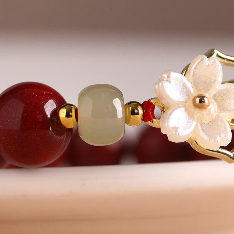 Braccialetto di benedizione con fiore di pietra di tridacna con perline di giada naturale di cinabro Buddha Stones