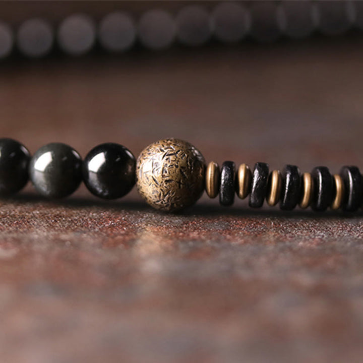 Braccialetto multistrato positivo in legno di ebano, ossidiana arcobaleno e rame Buddha Stones