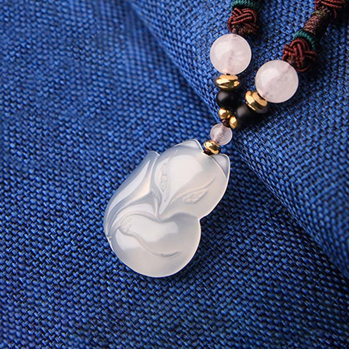 Collana con ciondolo in corda dell'armonia con perline di cristallo rosa di volpe e calcedonio Buddha Stones
