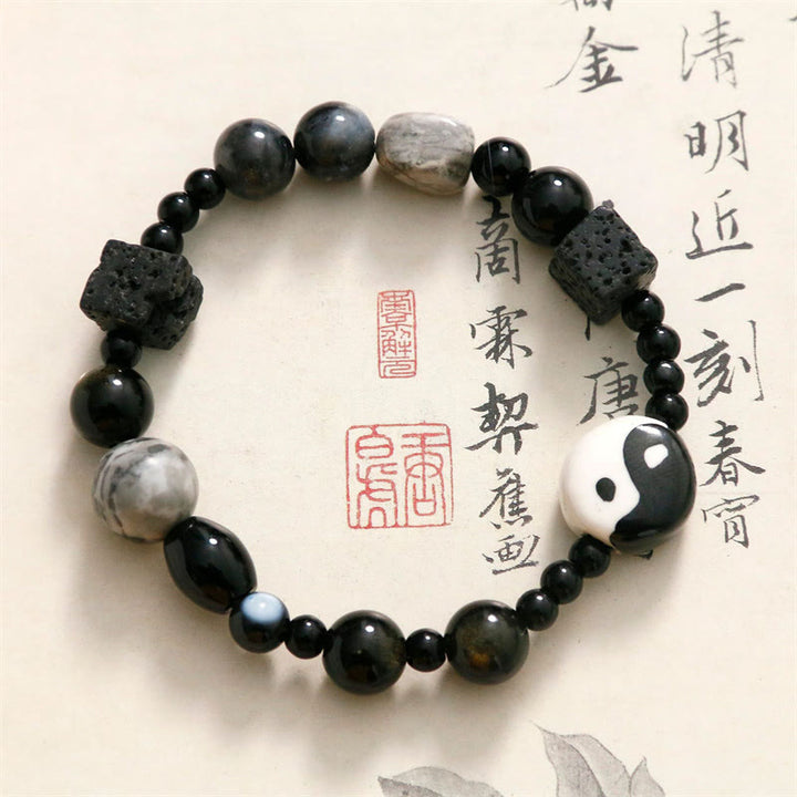 Braccialetto di protezione della fortuna Yin Yang con perline di diaspro Picasso in onice nero Buddha Stones - image 1