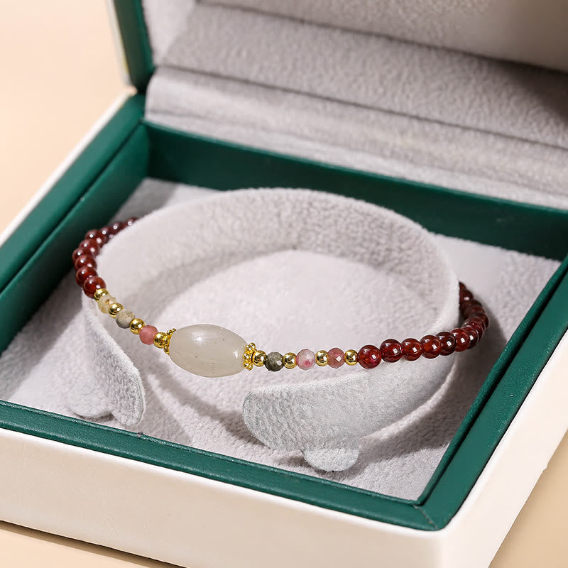 Bracciale Buddha Stones con perline di giada, tormalina e granato