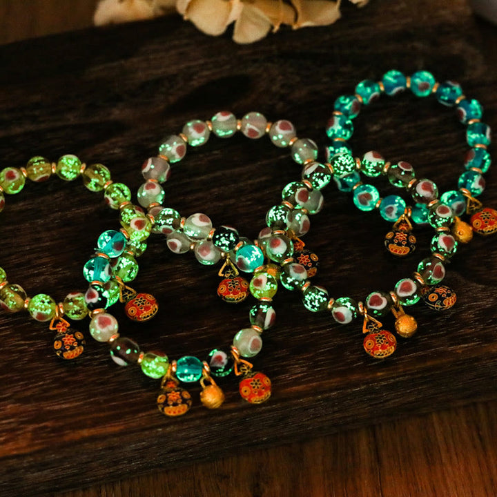 Braccialetto di perline di vetro fluorescente luminoso Liuli con cuore rosa della famiglia di bestie che ingoiano Buddha Stones