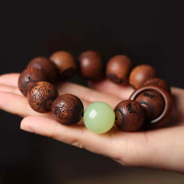 Braccialetto di protezione della tigre con incisione in palissandro tibetano e Buddha Stones