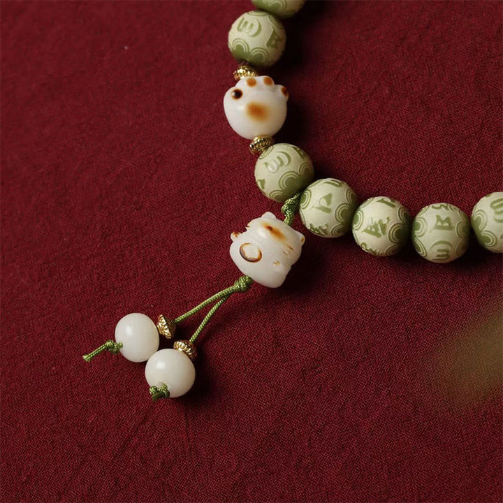 Buddha Stones Semi di Bodhi verdi Zampa di gatto Om Mani Padme Hum Braccialetto della saggezza inciso - image 5