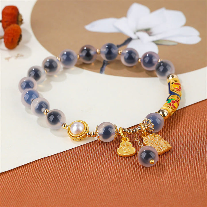Braccialetto di forza con amuleto in agata blu caramella naturale Buddha Stones