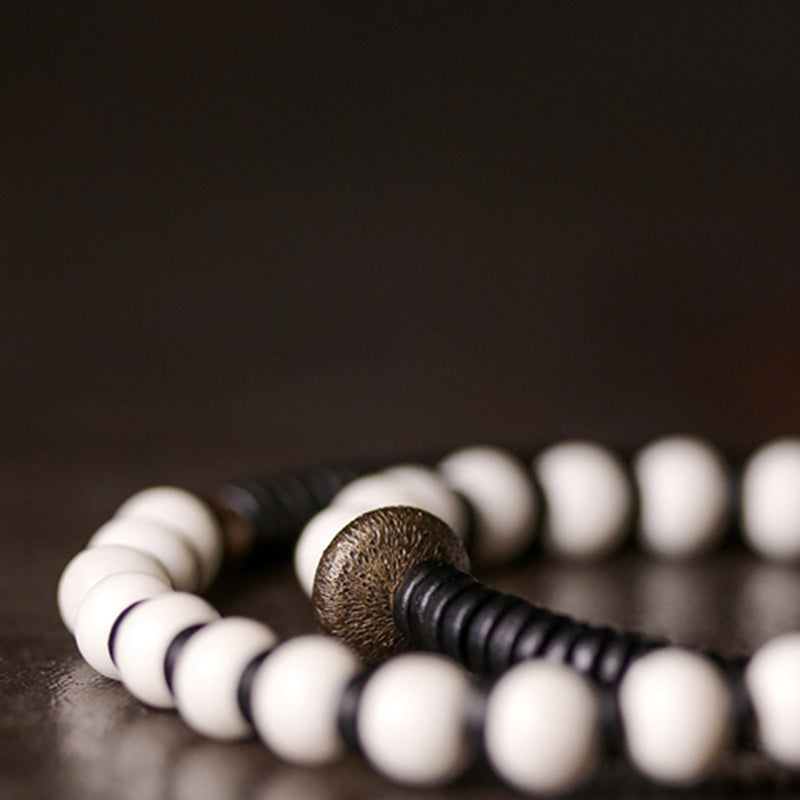 Braccialetto di coppia con perline di osso, ebano, Buddha Stones e rame