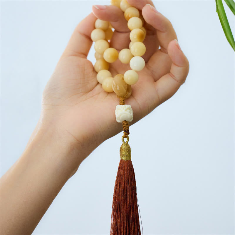 Buddha Stones Semi di Bodhi naturali Avorio Frutta Leone danzante Ciondolo Armonia Nappa Polso Mala