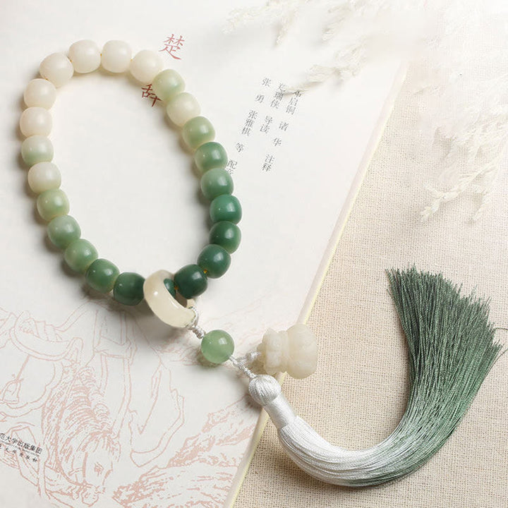 Buddha Stones Naturale Gradiente Bodhi Seed Fortuna Sacchetto di Denaro Loto Saggezza Nappa Polso Mala