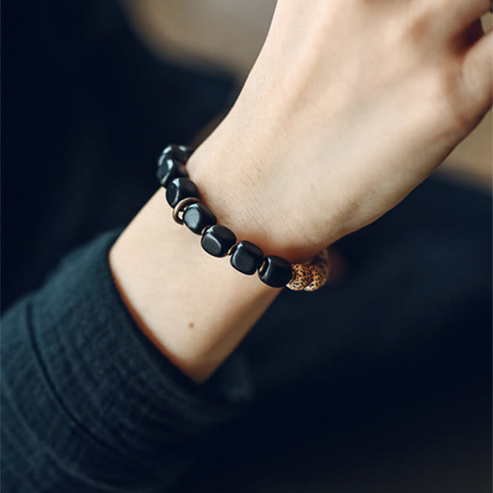 Buddha Stones Semi di Bodhi Tibetano Ossidiana Nera Legno di Ebano Rame Braccialetto della Pace