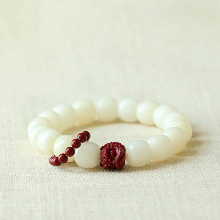 Buddha Stones Semi di Bodhi naturale Cinabro Leone danzante Charm Saggezza Armonia Polso Mala