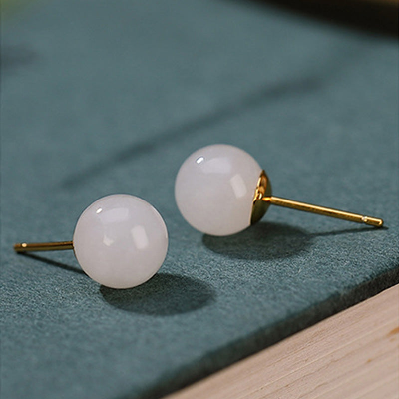 Orecchini a bottone rotondi in giada bianca con Buddha Stones in argento sterling 925