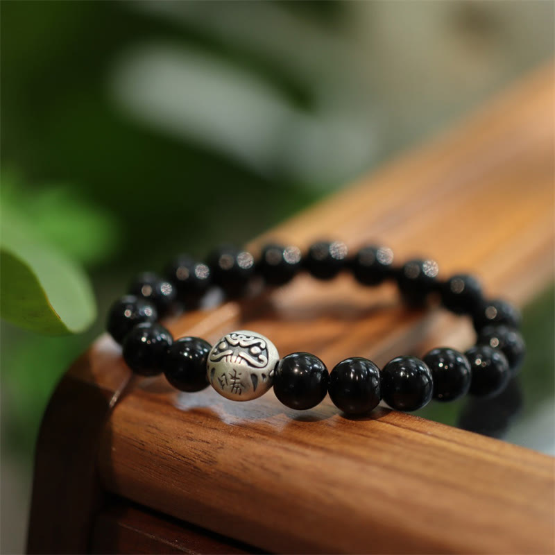 Braccialetto di protezione con perline di onice nero in argento sterling 925 Buddha Stones con incisione del personaggio