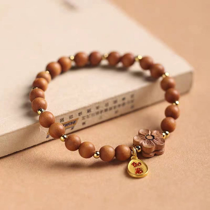 Braccialetto di protezione con ciondolo Ruyi in legno di sandalo rosso con piccole foglie di sandalo naturale in fiore di pesco Buddha Stones