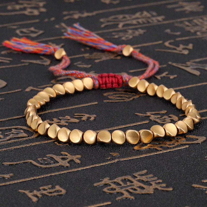 Braccialetto portafortuna con perline di rame tibetano Buddha Stones