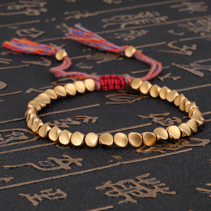 Braccialetto portafortuna con perline di rame tibetano Buddha Stones