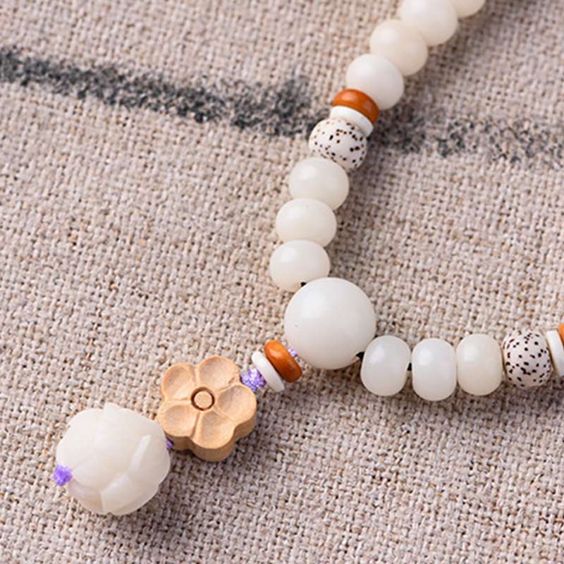 Braccialetto di benedizione del loto Bodhi in giada bianca tibetana Buddha Stones