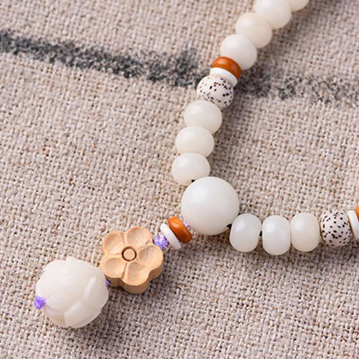 Braccialetto di benedizione del loto Bodhi in giada bianca tibetana Buddha Stones