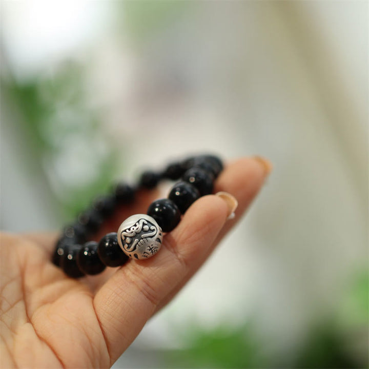 Braccialetto di protezione con perline di onice nero in argento sterling 925 Buddha Stones con incisione del personaggio