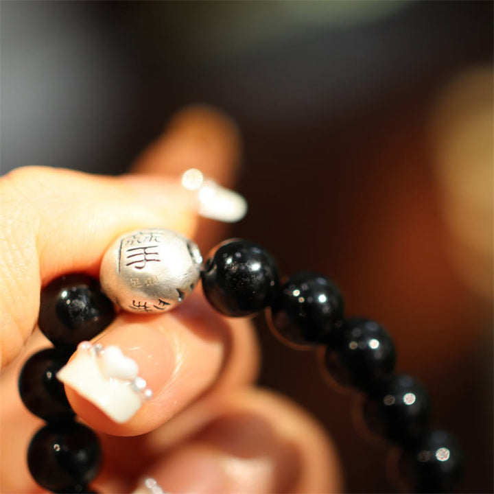 Braccialetto di protezione con perline di onice nero in argento sterling 925 Buddha Stones con incisione del personaggio