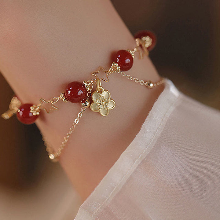 Bracciale Buddha Stones placcato oro 14k con ciondolo a forma di fiore di agata rossa e stella