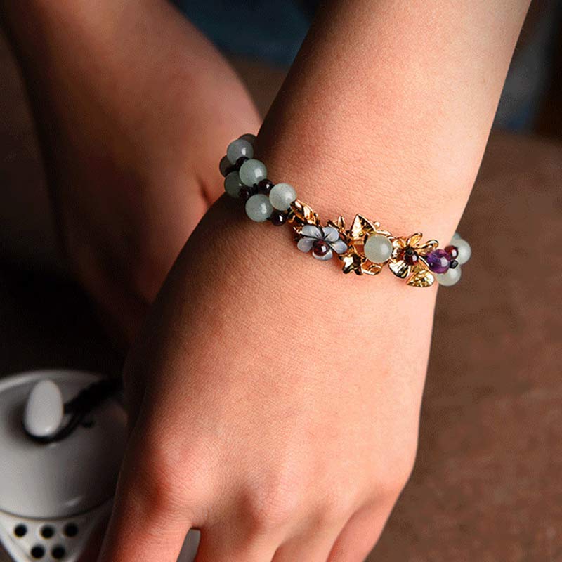 Braccialetto della fortuna con perline di fiore, petalo, avventurina verde e granato Buddha Stones