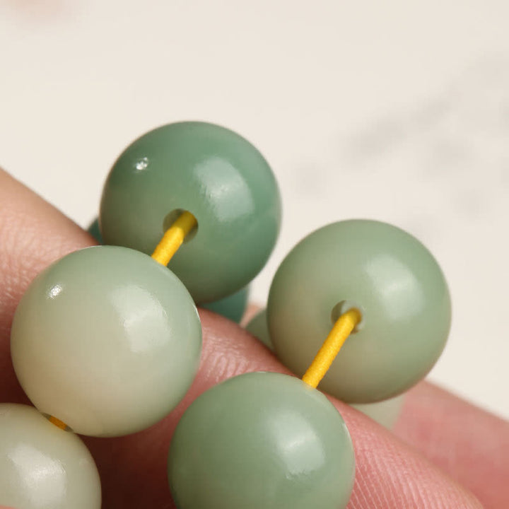 Buddha Stones Naturale Gradiente Bodhi Seed Fortuna Sacchetto di Denaro Loto Saggezza Nappa Polso Mala