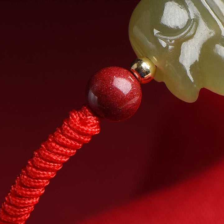 Braccialetto di corda dell'abbondanza di perline di cinabro con coniglietto di giada di Hetian dell'anno del coniglio