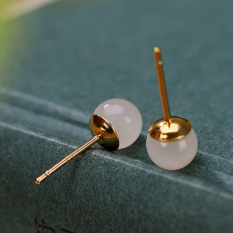 Orecchini a bottone rotondi in giada bianca con Buddha Stones in argento sterling 925