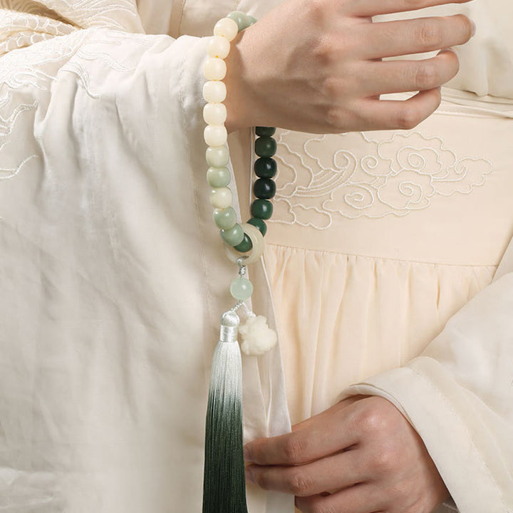 Buddha Stones Naturale Gradiente Bodhi Seed Fortuna Sacchetto di Denaro Loto Saggezza Nappa Polso Mala